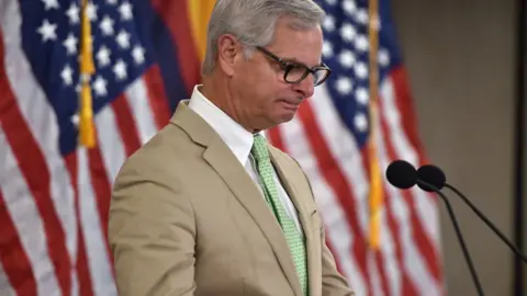 Getty Images Rick Davis reads John McCain's last message to the American people.