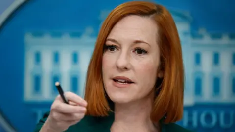 Getty Images White House press secretary Jen Psaki talks to reporters at the White House.