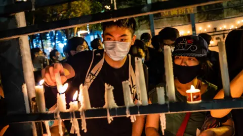 Getty Images Protesters light candles during the 31st anniversary of the Tiananmen Massacre. Thousands gathered for the annual memorial vigil in Victoria Park to mark the 1989 Tiananmen Square Massacre despite a police ban citing coronavirus social distancing restrictions.