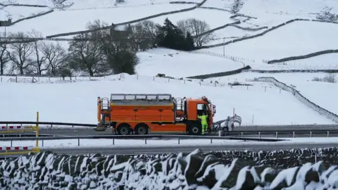 PA Media A snow plough on the A66 near Bowes in County Durham where the road was closed due to heavy snow