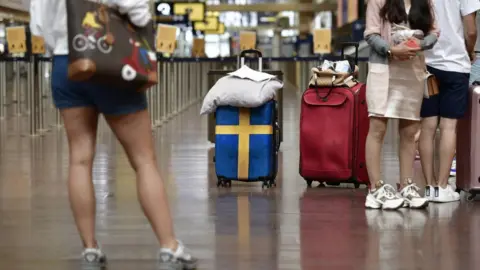Getty Images Passengers ready to check in at Arlanda airport in Stockholm