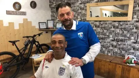 Nino Gioia Nino cutting the hair of client Chris Trippier