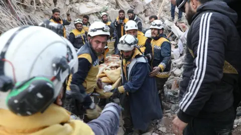 Foreign, Commonwealth and Development Office  White Helmets rescue teams extracting a casualty from rubble in northern Syria