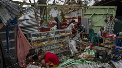 Getty Images residents recover items in Gattaran