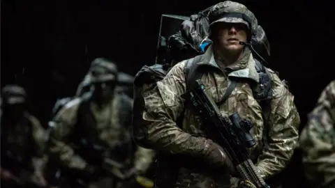 British Army Soldiers on a previous march at night