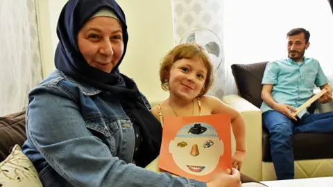 Om Mudar with her daughter Naya and husband Salim