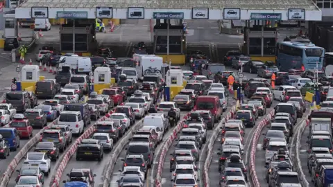 PA Media Lines of vehicles queueing to enter the port of Dover