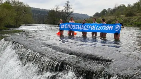 Surfers Against Sewage Protesters in the Warleigh Weir, near Bath