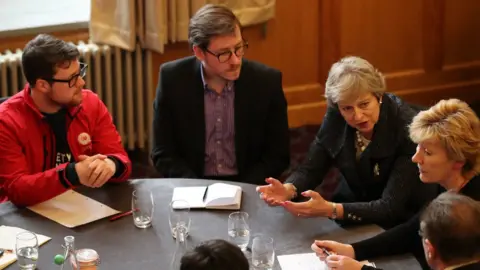 PA Prime Minister Theresa May speaks to people at Queen's University in Belfast