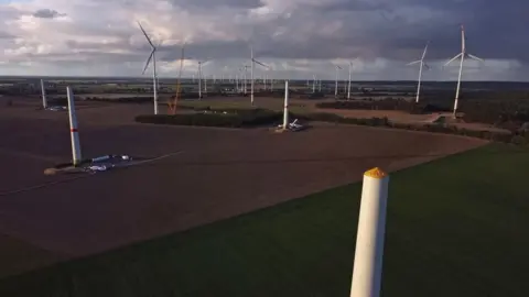 Getty Images New wind turbines stand under construction at a wind farm on October 12, 2021 near Biegen, Germany.