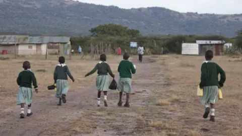 Getty Images Children going to school in a rural area of Kenya