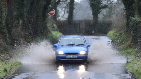 Pacemaker Car drives through flooded road