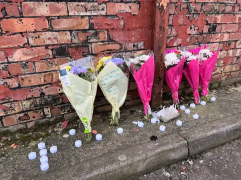 Martin Barber/BBC Floral tributes near Wellington Road, Great Yarmouth