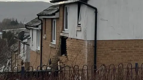 The occupants of two houses have not yet been allowed to return