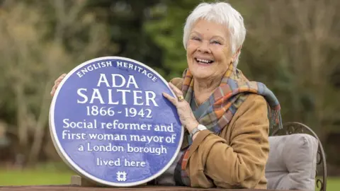 Christopher Ison Ada Salter plaque held by Dame Judi Dench