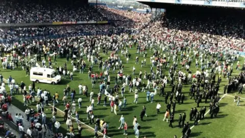 Hillsborough Inquests Hundreds of fans running on to the Hillsborough pitch in a bid to escape the terrace crush
