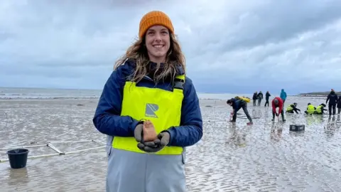 Bethan Thomas - holding seed bag