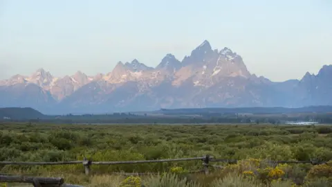 Getty Images The sun rises over Grand Teton National Park on August 21, 2017 outside Jackson, Wyoming.