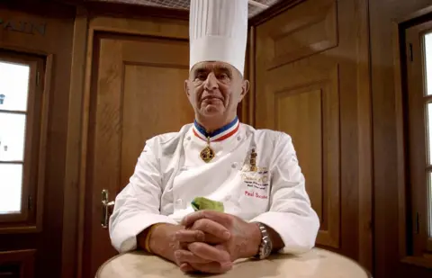 AFP Paul Bocuse in 2007 wearing a tall chef's hat