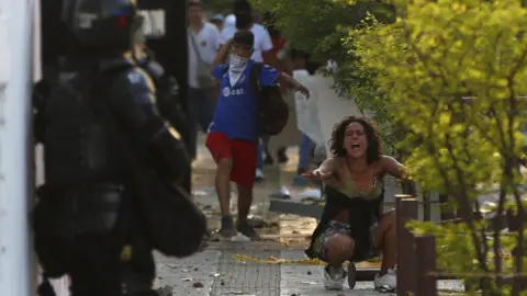 EPA Members of the police and protesters clash in Cali