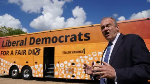 PA Media Lib Dem leader Sir Ed Davey launched his party's campaign battle bus in Whittlesford, Cambridge