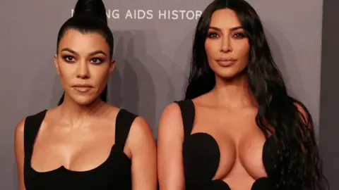 Reuters Kourtney Kardashian and Kim Kardashian West