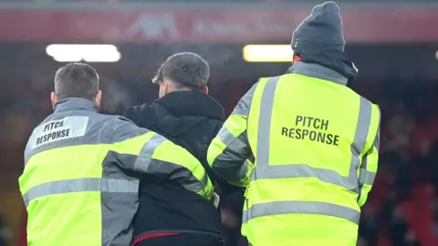 Liverpool pitch invader