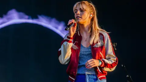 Getty Images Hannah Reid on stage