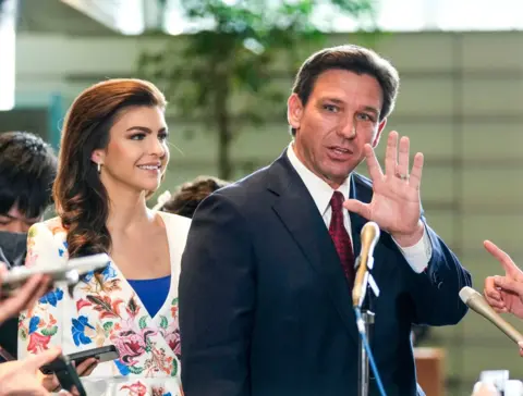 Getty Images Ron DeSantis with wife Casey in Tokyo last month