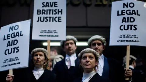 ANDREW COWIE Legal aid cuts protest