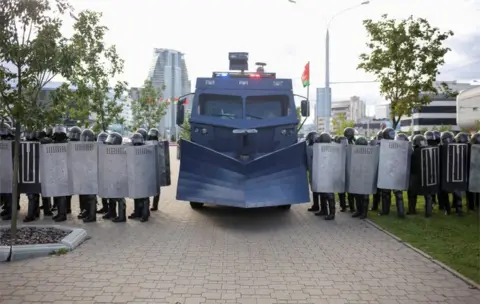 Reuters Belarusian riot police with snow-plough-like crowd control vehicle