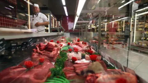 Getty Images Meat is displayed in a French supermarket