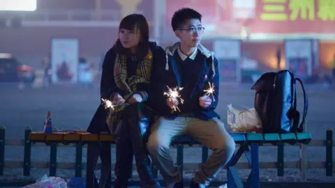 AFP Picture of couple holding sparklers