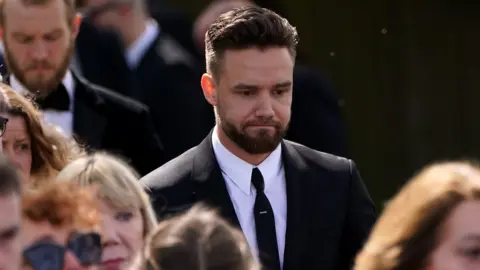 PA Media One Direction singer Liam Payne attends Tom Parker's funeral