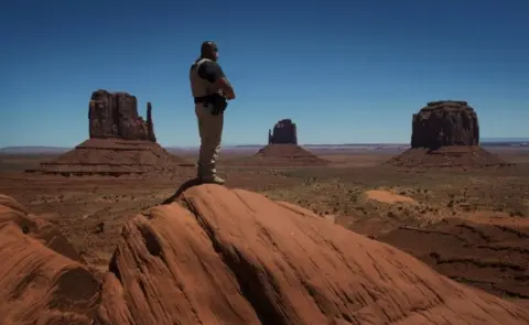 AFP A Navajo park ranger looks out over Navajo Nation-managed Monument Valley