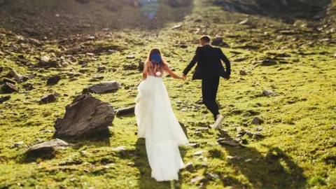 Getty Images Wedding couple on mountain