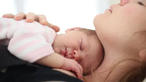 Getty Images Mother and newborn baby