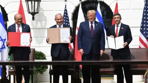 Getty Images Bahrain's foreign minister, Israel's PM, US President Donald Trump and the UAE's foreign minister