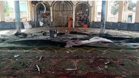 EPA Debris and blood stains inside a mosque in Kunduz, Afghanistan. Photo: 8 October 2021