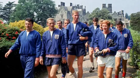 PA Media Jack Charlton (centre) with members of the England squad in 1966