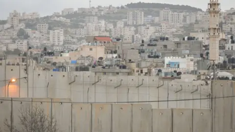 NurPhoto via Getty Images Israeli West Bank barrier in Bethlehem. Tuesday, 13 March 2018, in Bethlehem, Palestine