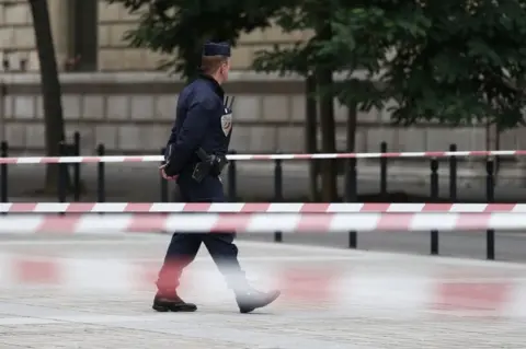 EPA French police and security forces establish a security perimeter near Paris police headquarters.