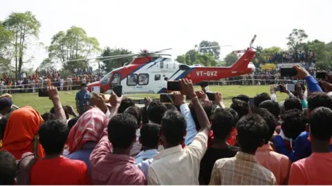 Getty Images Bihar Chief Minister Nitish Kumar leaves by a helicopter after addressing an election campaign rally ahead of Bihar Assembly election on October 22, 2020 in Muzaffarpur, India.