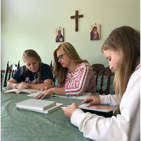 Photo courtesy Regina Caeli Children studying
