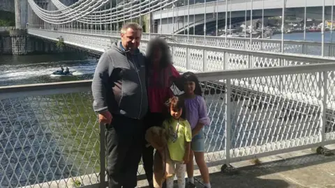 Facebook Bartlomiej Kuczynski, 45, a woman, 12-year-old-Jasmin Kuczynska, and Natasha Kuczynska, aged nine, near a river bridge