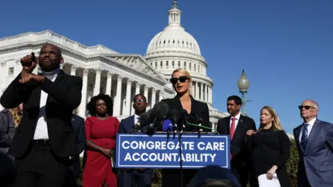 Getty Images Actress and model Paris Hilton speaks during a news conference outside the U.S. Capitol October 20