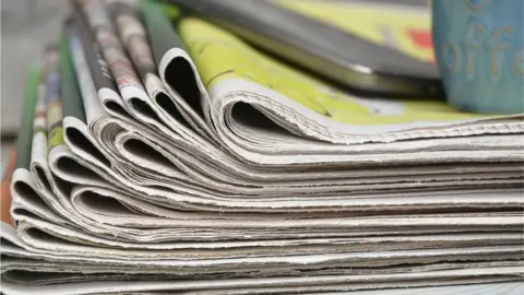 Thinkstock pile of newspapers