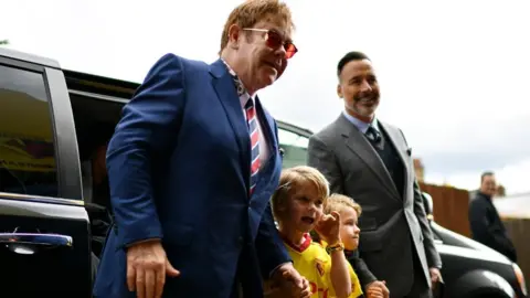 Getty Images Elton John with his sons and husband David Furnish