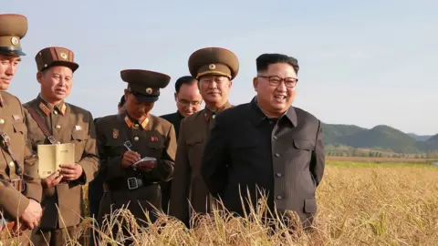 KCNA This undated picture released from North Korea"s official Korean Central News Agency (KCNA) on September 30, 2017 shows North Korean leader Kim Jong-Un (R) visiting Farm No. 1116 under Korean People"s Army (KPA) Unit 810 at an undisclosed location