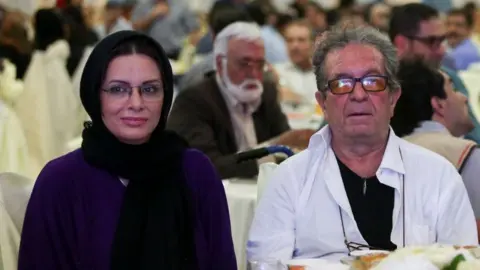 Getty Images Iranian film director Dariush Mehrjui and his wife Vahida Mohammadifar